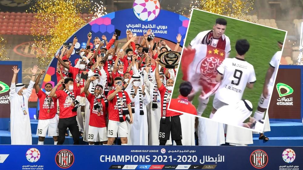 محمد ربيع (لاعب أمل الوداد سابقا) يحتفل بتتويج فريقه الجزيرة بلقب الدوري الإماراتي متشحا بـ"علم الفريق الأحمر"