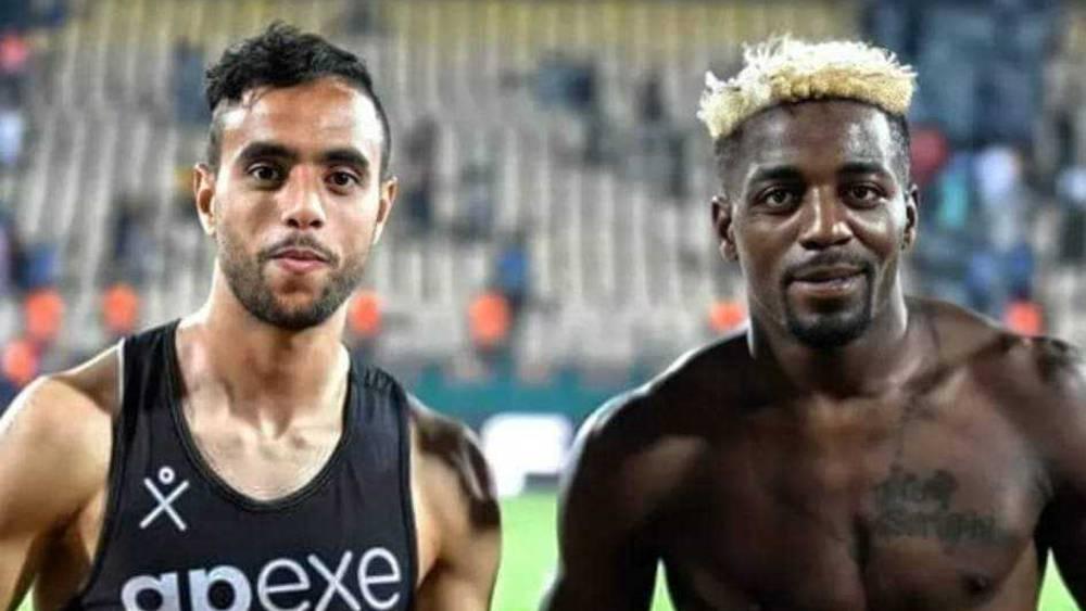 الشيبي وأكسيل مايي يتبادلان القمصان ويلتقطان صورة للذكرى في ملعب "أحمدو أهيدجو"