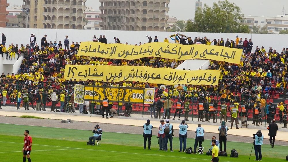 جماهير المغرب الفاسي: "الجَامعي و المراكْشِي يتبَادلُون الإِتّهامات..وفلُوس لورَاق معرفْناشْ فِين مْشات..!"